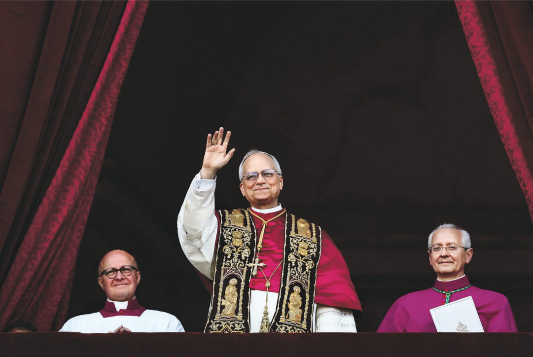 The new pope greets the crowd from the balcony